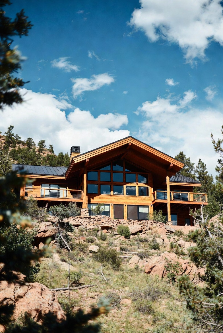 Rocky Mountain timber cabin at dusk — JLA property photography